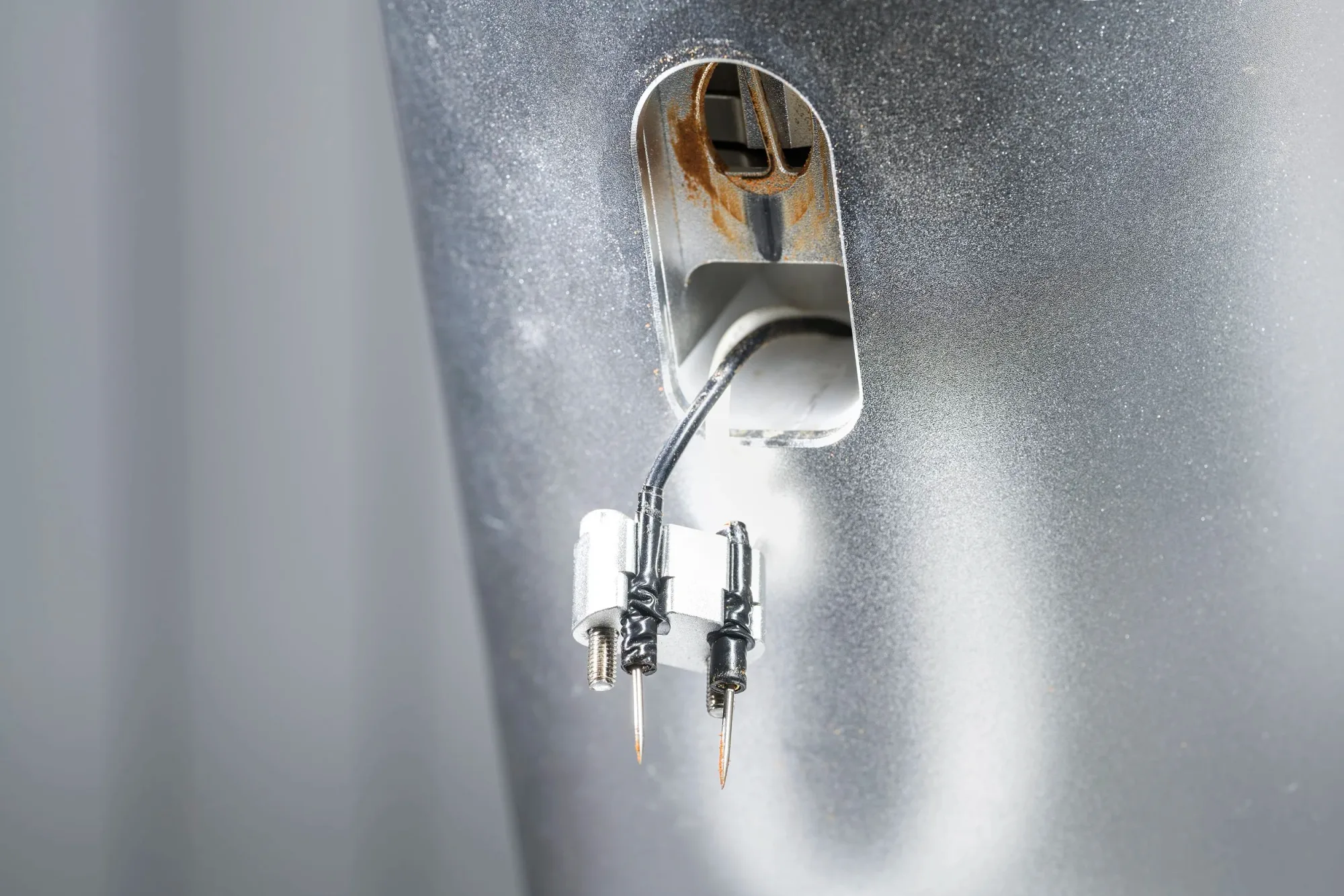 Deionizer probes sit in a holder, screwed into the knocker chute; easy.
